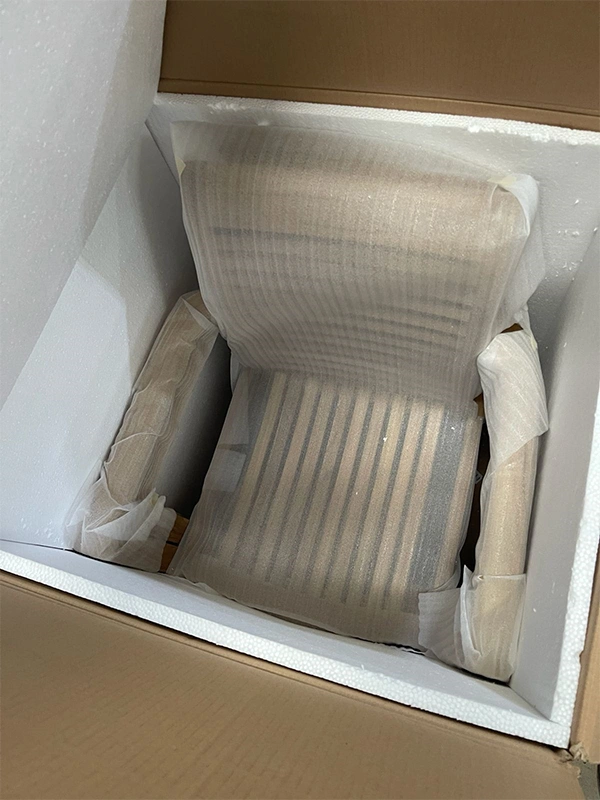Custom wooden chair protected with packaging for export shipment